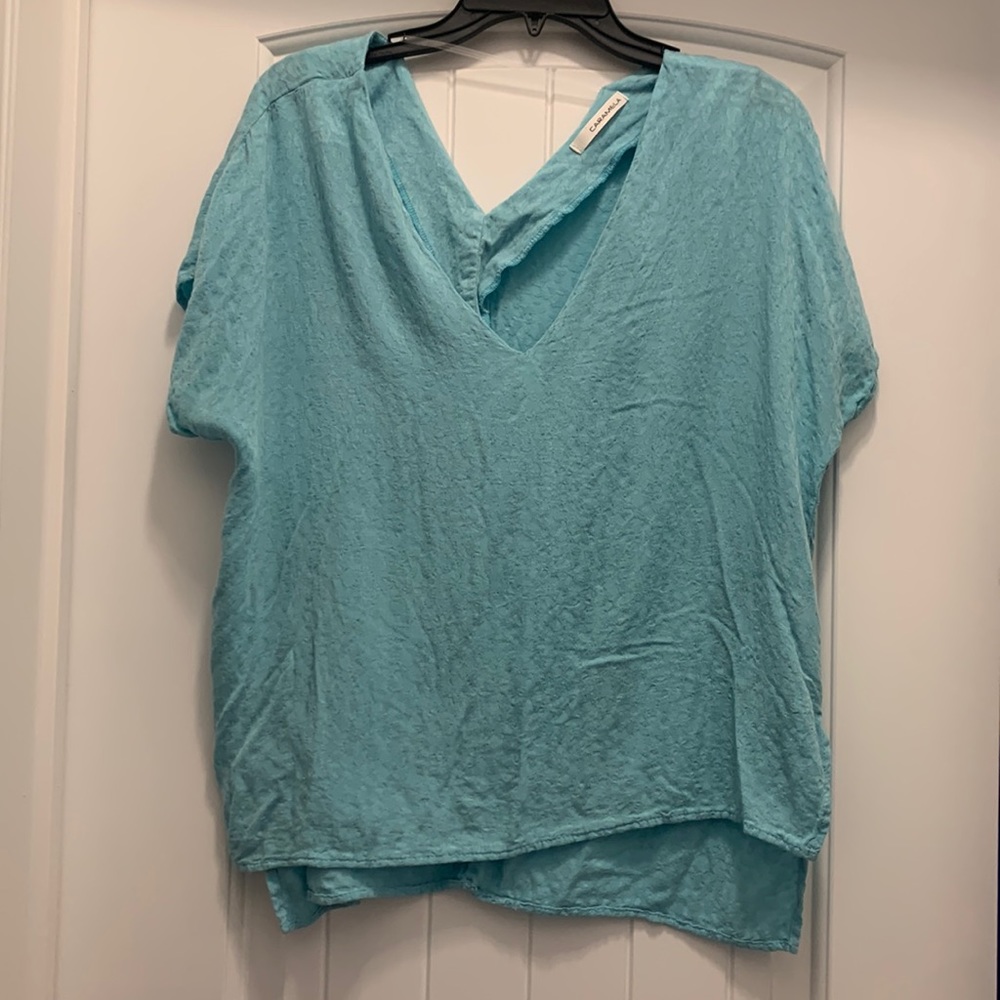 Caramela light blue, leopard print, loose-fitting top, size medium. Like new.